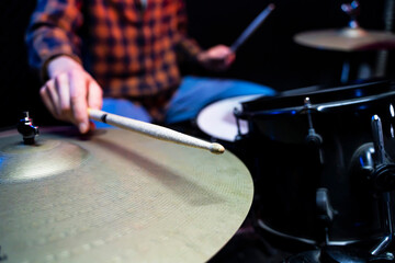 close up  hand of man musician playing on drums in music studio