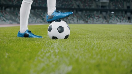Unrecognizable female standing with soccer ball on side of a field of a huge stadium
