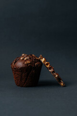 delicious chocolate muffin with chocolate drops and chocolate bar with nuts. High quality photo
