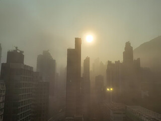 sunrise over residential buildings in Sheung wan, Hong Kong Island,. backlight