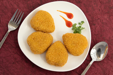 Heart Shaped Veg Paneer Cutlet Tikki With Bhujia Sev Coating Made Of Indian Cottage Cheese Crumbled Panir Spices Maida Green Vegetables Like Carrot, Beans, Cabbage, Capsicum, Sweet Corn And Mix Herbs