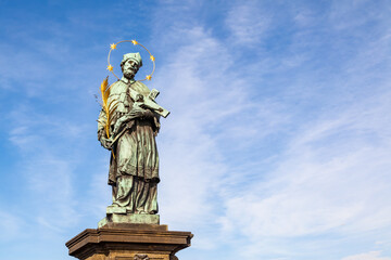 Fototapeta na wymiar Statue of John of Nepomuk on Charles Bridge in Prague