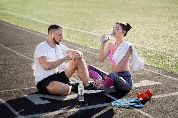 Athletes rest after an active training session at the stadium