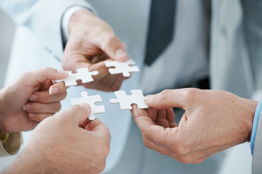 When a business plan comes together.... A business concept image of puzzle pieces fitting together - closeup.