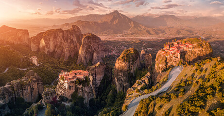 Panoramic majestic aerial view of the famous Meteora flying monasteries in Greece at autumn. Travel to the wonders of the world. Visit tourist attractions and landmarks