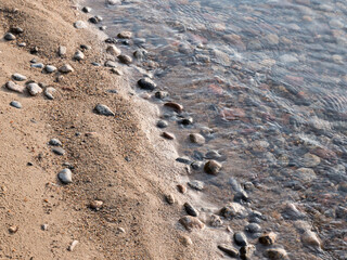 Sand and small stones on natural beach