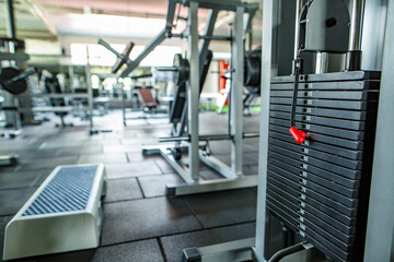 
Modern lightweight gym. Sports equipment in the gym. bars of different weights on the rack.