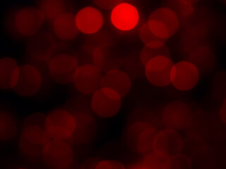 Abstract blur image of red light of beautiful bokeh on black background. Blurred festive, night...