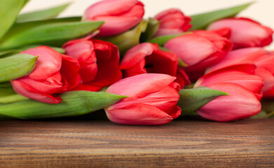 free wooden surface with a bouquet of tulips