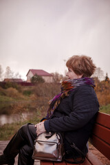 55-year-old woman walks in   pine forest