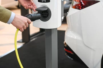 Fototapeten auto voiture electrique recharge borne rechargement batterie autonomie charge prise electricité © JeanLuc