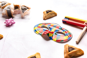 Purim celebration concept, Jewish carnival holiday, over white background. Top view, Flat lay. High quality photo