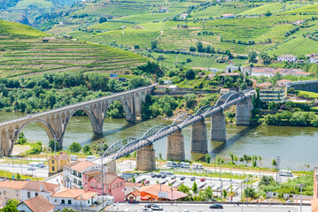 View of Peso da Regua in Alto Douro Wine Region, Portugal - A UNESCO World Heritage Site - obrazy, fototapety, plakaty