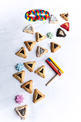 Purim celebration concept, Jewish carnival holiday, over white background. Top view, Flat lay. High quality photo