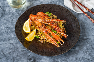Langoustines with ginger, spring onions and crispy fried egg noodles