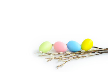 easter background, easter painted eggs and willow branches on a white background, copy space - obrazy, fototapety, plakaty