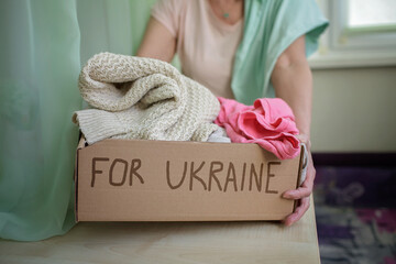 Volunteer collecting clothes and other stuff for Ukrainian refugees suffered from Russian invasion....