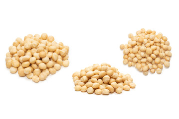 Macadamia nuts isolated on white background.