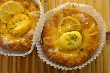 Denish pastry with lemon slices and cheese in a gown.
