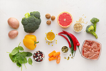 Set of healthy products with pills on white background