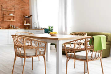 Dining table and chairs in modern kitchen interior