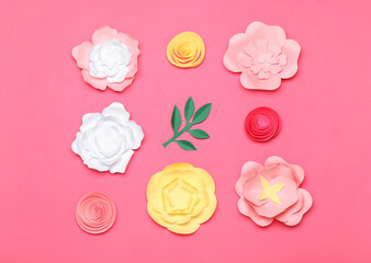 Beautiful handmade paper flowers on pink background
