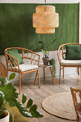 Interior of stylish living room with wicker chairs, table and houseplants