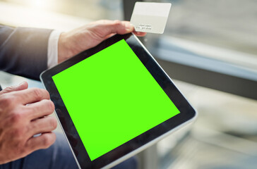 The easiest way to connect in business. Cropped shot of an unrecognizable businessman using a digital tablet with a green screen in a modern office.