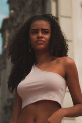 Portrait of a beautiful brunette woman with curly hair