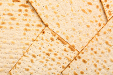 Traditional Jewish flatbread matza for Passover as background, closeup