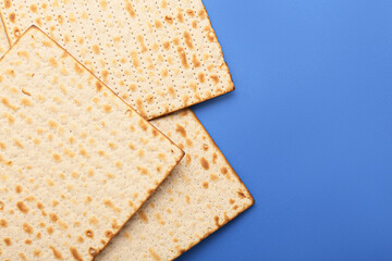 Jewish flatbread matza for Passover on blue background