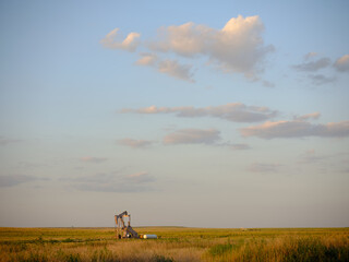 Fototapeta na wymiar An oil drilling rig in a Kansas field
