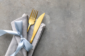 Elegant cutlery on grey background