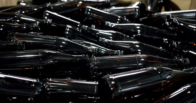 Clean beer and wine bottles. Beer bottles in production and bottling. Technological line. factory concept. Glass recycling process, Recycled beer bottles in factory. conveyor belt at bottle factory