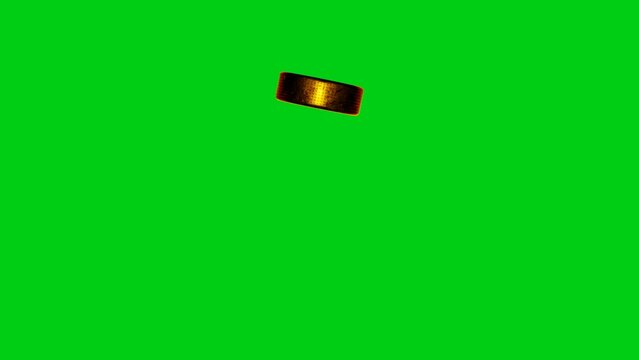 Golden hockey puck flies into camera on chromakey background. Sports concept. Green screen.	