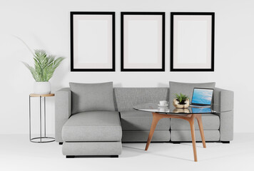Room view with sofa, table and laptop and frames for filling content. A minimalistic concept, a modern flat in a light pastel color. 3D render, 3D illustration.