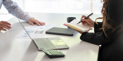Asian business adviser meeting to analyze and discuss the situation on the financial report in the meeting room.Investment Consultant,Financial Consultant,Financial advisor and accounting concept