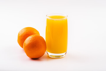 Orange juice glass with orange fruits. Isolated on white background. High resolution, copy space, healthy, vitamin drink