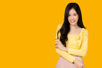 Happy beauty asian woman portrait She look at camera with happy and smile face Expressive facial expressions Beautiful girl get confident Young lady feel relax Isolated on yellow background copy space