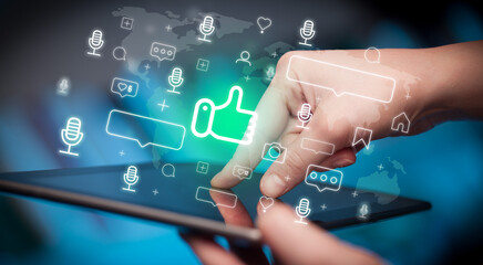 Close-up of a hand using tablet, social media concept