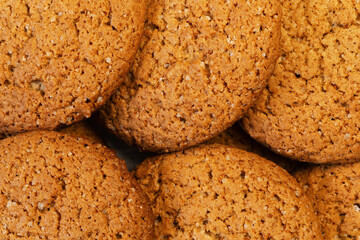 Arranged rows of round oatmeal cookies for background