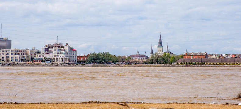 Cityscape of the French Quarter of New Orleans sandwiched between the sky and the Mississippi River