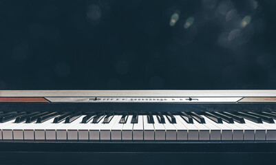 Piano keys isolated in the dark, copy space.