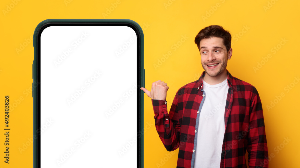 Poster man presenting big white empty smartphone screen
