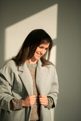girl in a gray coat stands with his back
portrait young beautiful brunette standing sunlight long straight hair eyes brown long eyelashes girl smiling dreams

