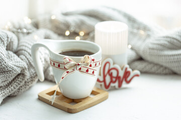 Fototapeta na wymiar Festive composition with a cup and decor details for Valentine's Day.