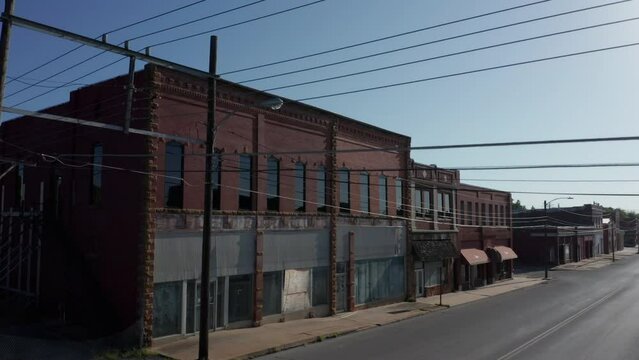 Vacant storefronts and empty sidewalks in small town America.