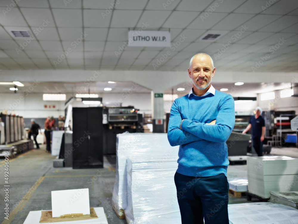Poster this is my factory and im proud of it. portrait of a man standing proudly in a printing factory.