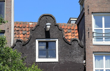 Amsterdam Oudezijds Voorburgwal Canal Aged Black Bell Gable Close Up, Netherlands