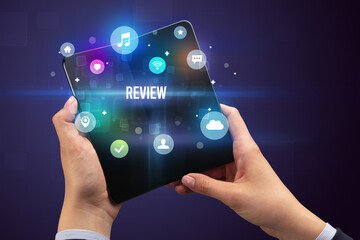 Businessman holding a foldable smartphone